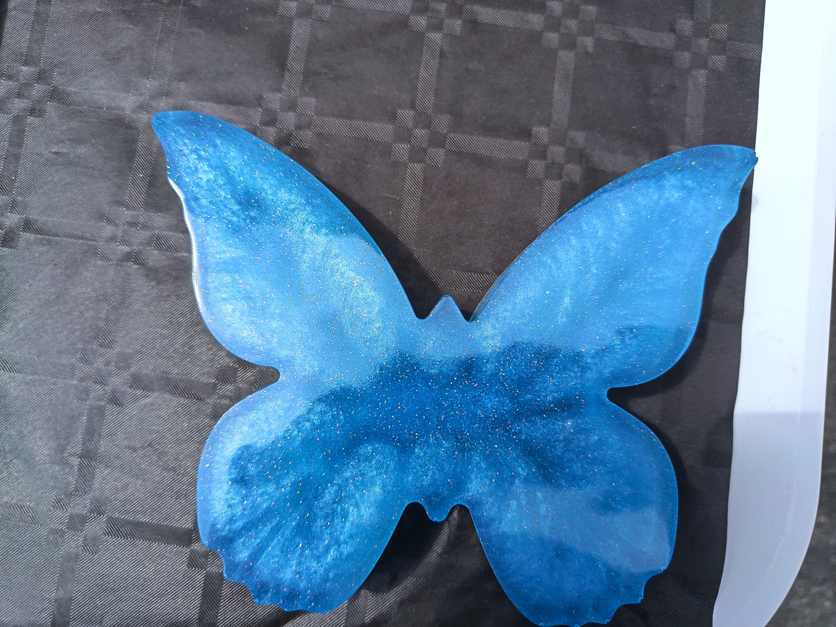 Papillon décoratif en résine époxy bleu turquoise nacré