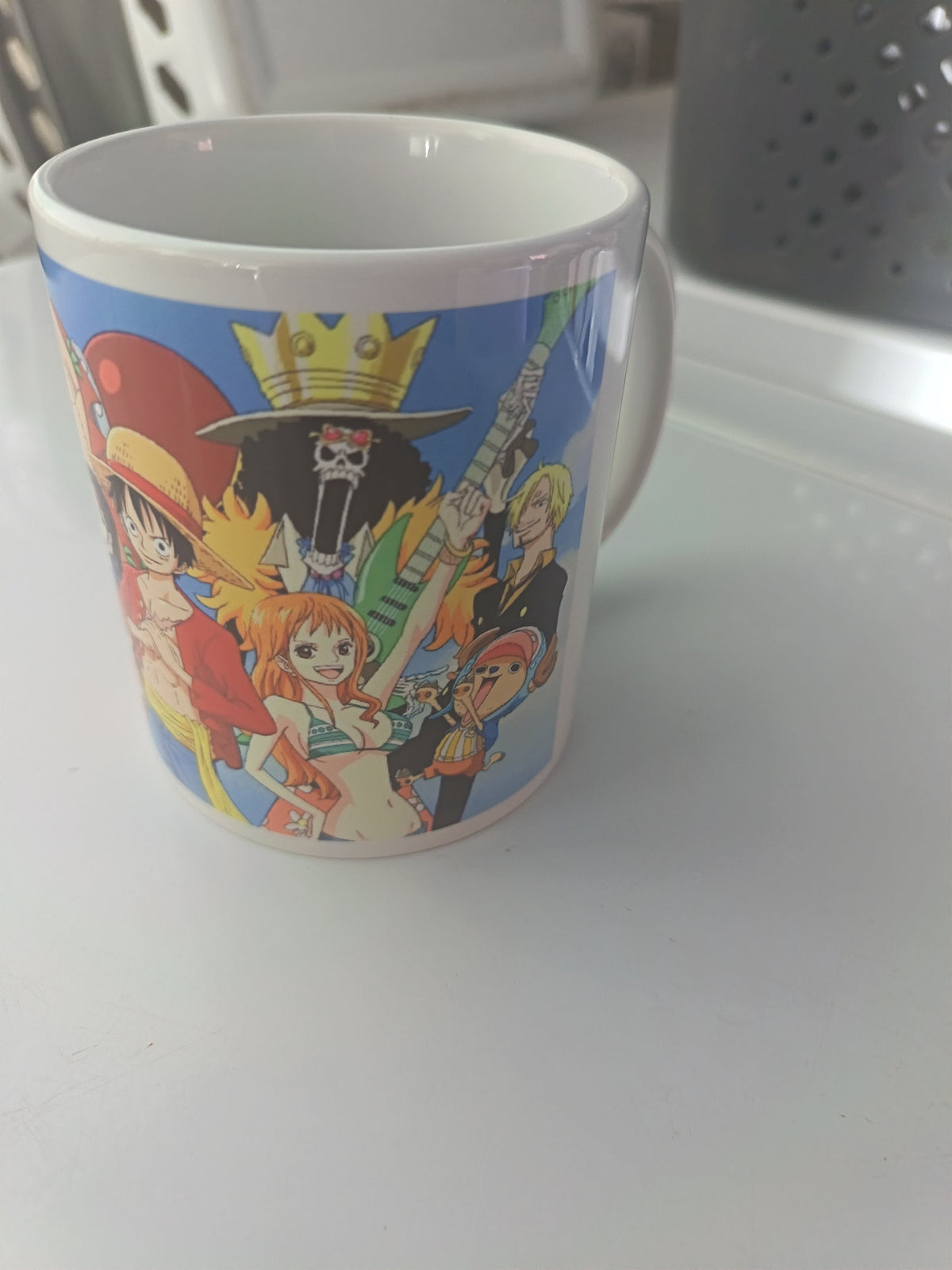 Tasse céramique One Piece Luffy Nami Zoro Sanji Chapeaux de Paille fond bleu